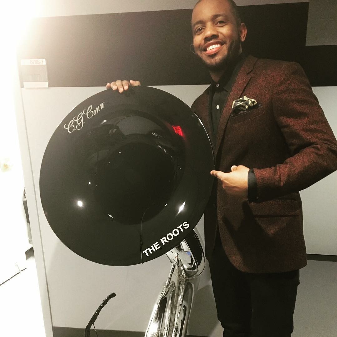 Damon Bryson beside his sousaphone